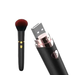 The PixiePizzazz Makeup Brush Vibrator shown with its USB charging tip exposed, revealing a rose gold connector for easy wireless charging.