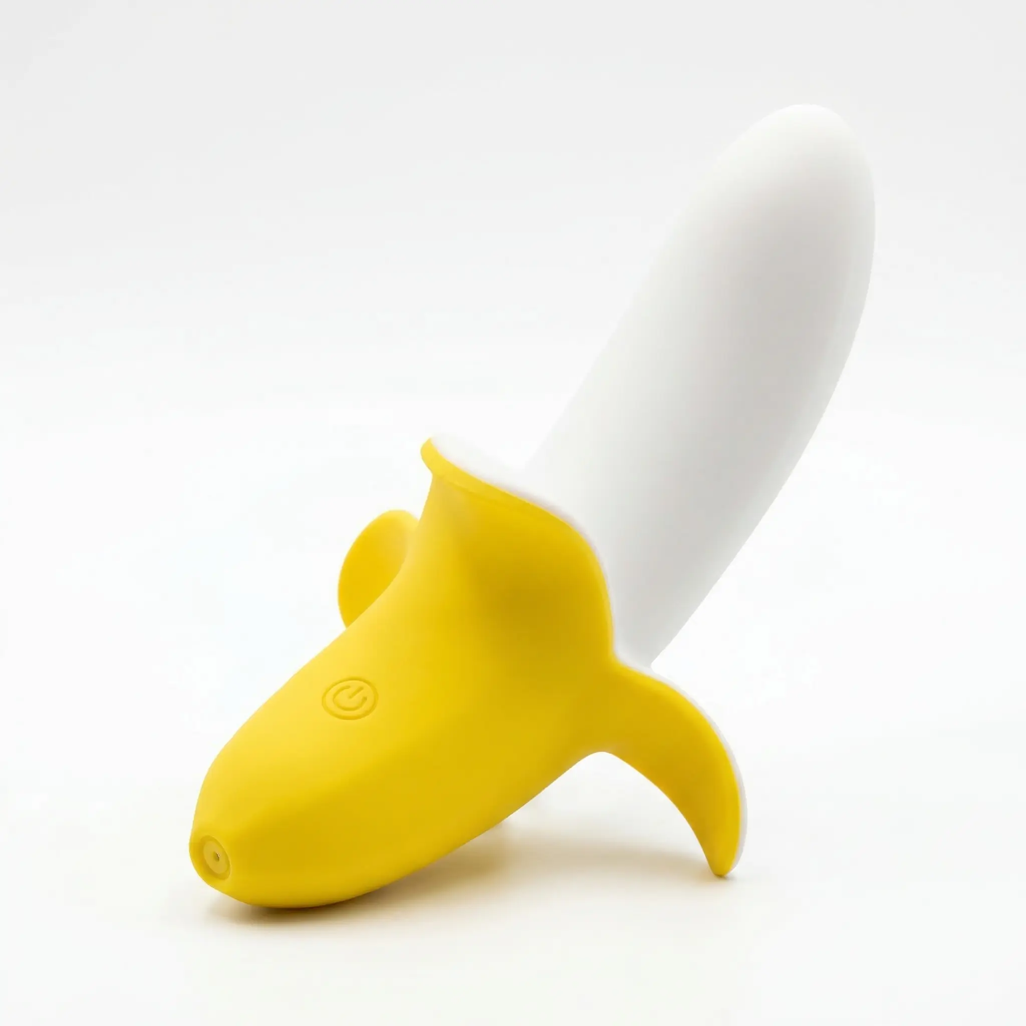 Yellow banana-shaped vibrating dildo vibrator with white tip on a clean white background