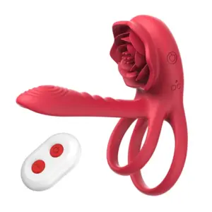 A red dual vibrating penis ring with a built-in textured shaft and rose-shaped stimulator, paired with a white remote for easy control.