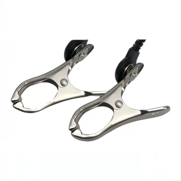 Close-up of the electric shock nipple clamps showing the metal clip design and attached wire connection for electro-stimulation.