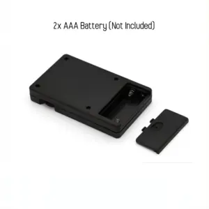 Battery compartment of the remote control for electric nipple clamps, labeled for two AAA batteries (not included).