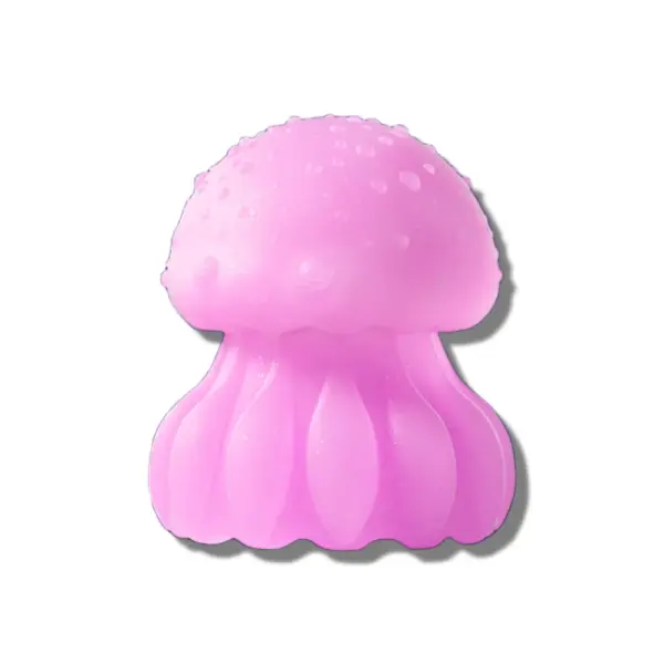 A soft pink jellyfish-shaped vibrator standing upright, showcasing its rounded bumpy top and ribbed lower half for external stimulation.