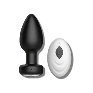 A black remote controlled butt plug paired with a white wireless remote featuring a power button, designed for hands-free control and enhanced pleasure.