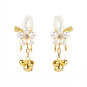 Close-up of the floral pearl nipple clamps with gold detailing and bell charms.