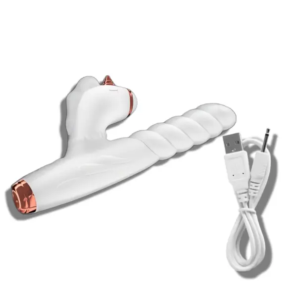 Thrusting dildo with unicorn-shaped clitoral sucker shown lying on its side, accompanied by a white USB charging cable with a round-pin connector.