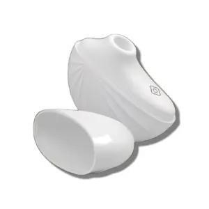 Angled view of the white suction cup vibrator with its cap removed, revealing the contoured suction opening and single-button control interface.
