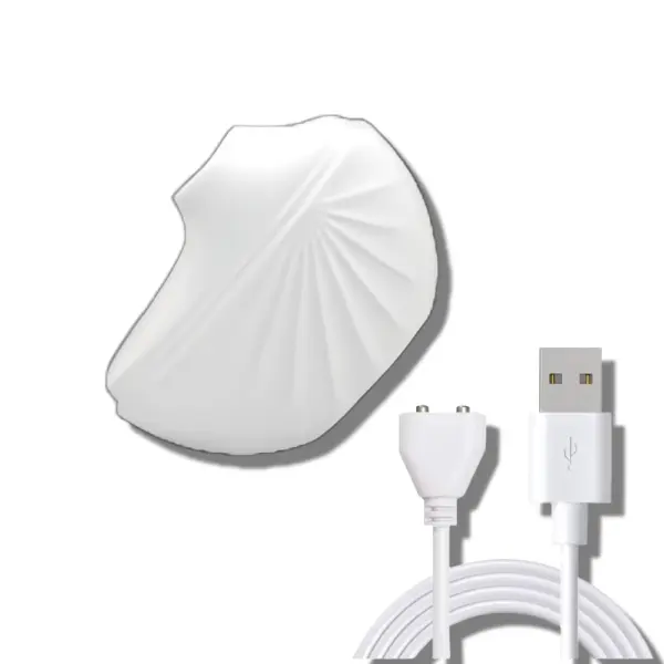 White suction cup vibrator with an elegant shell-like design shown next to its magnetic USB charger, highlighting its portability and discreet look.