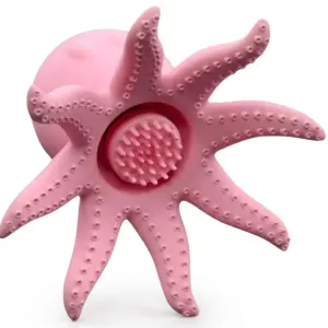 Bottom view of OctoVibes pink octopus-shaped stimulator showing textured suction center and detailed silicone tentacles