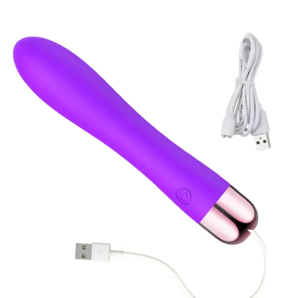 Purple 10 mode waterproof vibrating dildo lying at an angle, connected to a USB charging cable, showcasing its waterproof seal and rechargeable design.