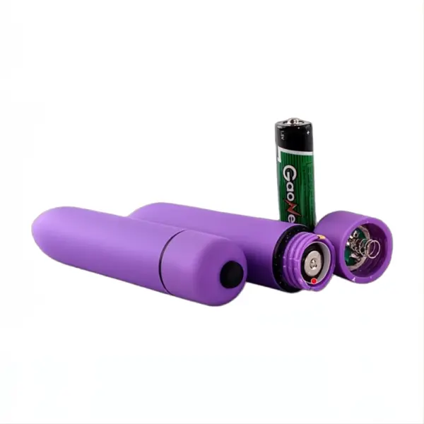 Battery powered bullet vibrator in purple shown disassembled with a visible AA battery and internal components, highlighting its easy battery replacement design.