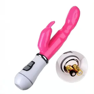 Pink Battery Powered Rabbit Vibrator – Deep Bliss lying on its side with its base removed, revealing two AAA batteries inside the compartment alongside a circular close-up insert of the open battery slot.