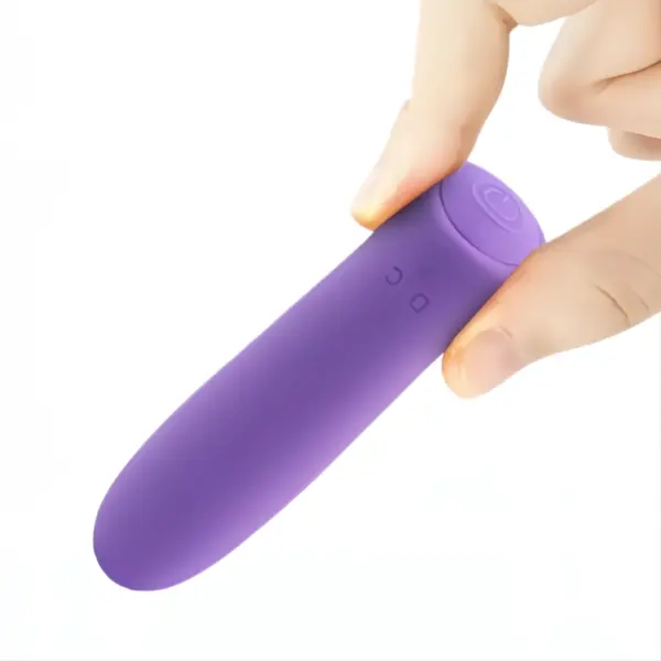 A hand holding the purple Fifion Powerful Mini Bullet Vibrator to showcase its compact size and ergonomic shape, with the charging port and power button visible near the top.