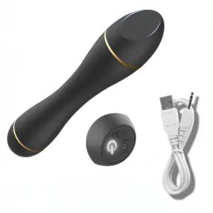 A flat head bullet vibrator displayed with its round charging base and a USB cable, highlighting its rechargeable convenience.