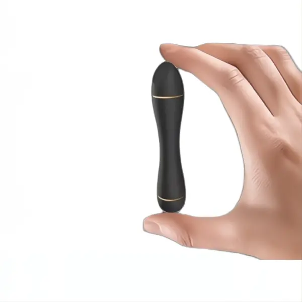 A person holds a black flat head bullet vibrator between their fingers, showcasing its compact, ergonomic size perfect for discreet use.