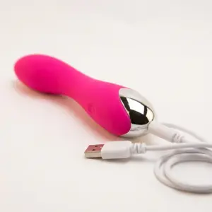 PulsingParadise waterproof silicone dildo in pink with curved shaft and chrome base, shown with USB charging cable