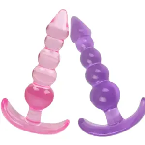 Two Darling Drizzle five-bead silicone butt plugs side by side—one pink, one purple—each with graduated beads and a curved T-handle.