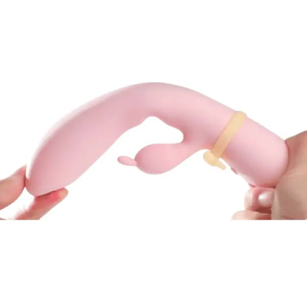 Flexible Rabbit Vibrator With Heating – Pretty in pink being bent by hand to showcase its flexible design.