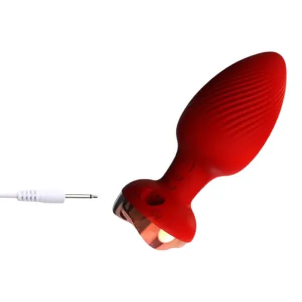 Remote Control Vibrating Butt Plug – The Murmur detail of the DC 5 V charging port on the red plug’s base alongside its charging cable