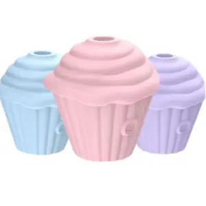 Three pastel-colored Cupcake Clit Suction Stimulators – Sweet Treat in pink, lavender, and baby blue, shaped like frosted cupcakes with power buttons visible on the base.