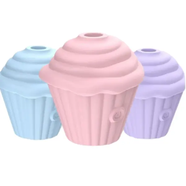 Three pastel-colored Cupcake Clit Suction Stimulators – Sweet Treat in pink, lavender, and baby blue, shaped like frosted cupcakes with power buttons visible on the base.