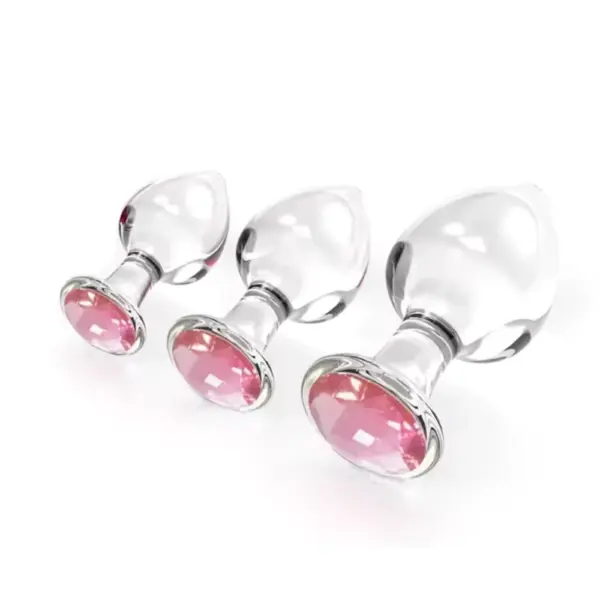 Three Crystal Clear Butt Plug – Clear Love models (Small, Medium, Large) displayed side by side, each with a clear glass body and pink jeweled base.