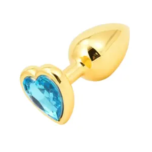 Butt Plugs With Jewel – Glitzie shown in polished gold with a vibrant heart-cut blue gemstone at the base for a sparkling, luxurious look.