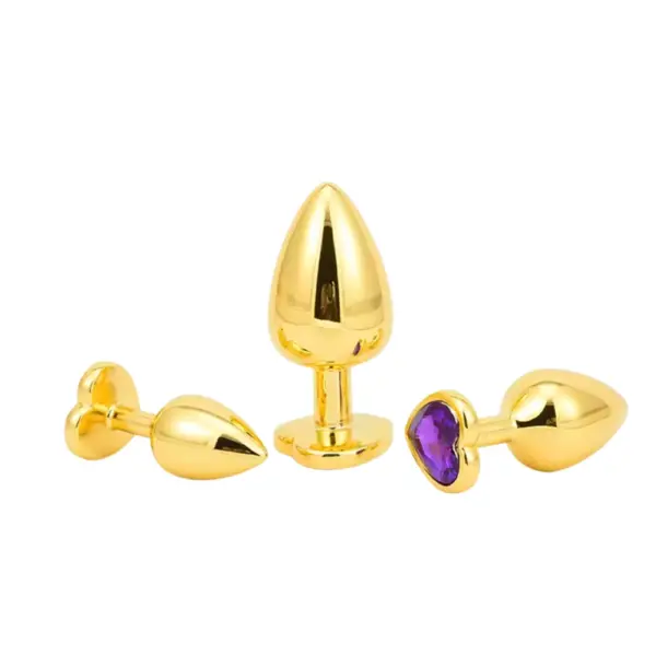 Butt Plugs With Jewel – Glitzie in various positions displaying tapered gold shapes and one plug featuring a deep purple heart-shaped jewel.