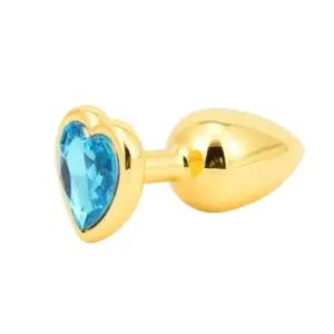 Butt Plugs With Jewel – Glitzie in gold featuring a sparkling light blue faceted heart gem embedded in the flared base.