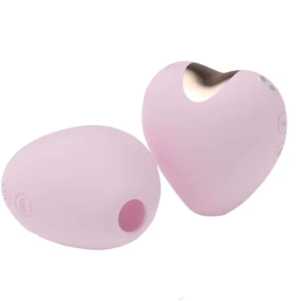 Two pastel-pink Passion Pull heart-shaped rechargeable suckers side by side—one angled to show the rose-gold trimmed metal suction flange and side control buttons, the other flipped over to reveal the silicone suction opening and power button.