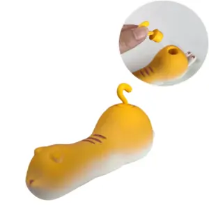 Yellow Kitty Suction Vibrator – Sexy Purr held in hand showing removal of kitty tail cap and exposed suction vestibule