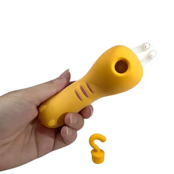Yellow Kitty Suction Vibrator – Top view of the Sexy Purr ergonomic kitty body gripped in hand with suction opening visible