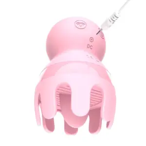 Close-up of the pink Licker and Sucker Vibrator - Octopussy with a charging cable plugged into the DC port at the back of the toy.