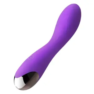 A deep purple, waterproof silicone vibrating dildo from the Pulsing Paradise collection, shown at an angled three-quarter view against a white background. The model features a gently curved shaft and a reflective metallic base accent.
