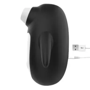 Side profile of the Artic Lust 10 Modes Suction Vibrator in black and white, connected to its USB charging cable, showcasing the ergonomic handle and side-mounted suction nozzle.