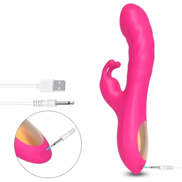 Close-up of the Velvet Whim Realistic Curved Bunny Vibrator being charged via USB cable, highlighting its pink design, ergonomic grip, and charging-friendly port.