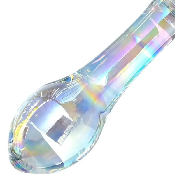Close-up of the clear glass shaft of the Garden Gate plug, highlighting its smooth, tapered form and the rainbow-hued reflections dancing through the iridescent material.