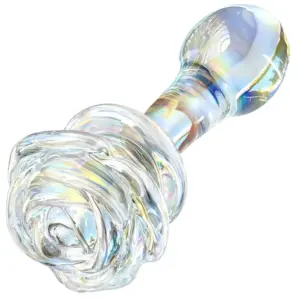 Iridescent clear glass butt plug featuring a sculpted rose bloom topper, shown at an angled perspective to highlight the swirling petal detail and tapered shaft.