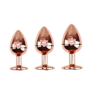 Three Blush Button rose-gold butt plugs side by side in small (28 mm), medium (34 mm), and large (40 mm) widths with labeled measurements.