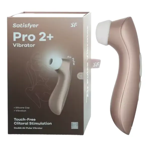 Side-by-side shot of the Satisfyer Pro 2+ Clit Sucker next to its rose-gold retail box labeled “Pro 2+ Vibrator” and “Touch-Free Clitoral Stimulation.” The sleek device features a white silicone cap over its air-pulse nozzle and a metallic handle, underscoring both its premium feel and discreet packaging design.