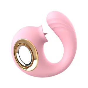 Angled view of the Flirty Flicker G-Spot With Licking Dolphin Vibrator in pastel pink, showcasing its sweeping curved body with integrated golden-ring finger loop and ribbed G-spot tip. The dolphin-inspired licking nozzle sits above the internal curve, underlining the toy’s dual-stimulation design and stylish, ergonomic form.