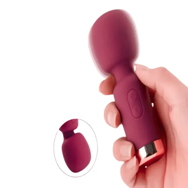 Vixen Vibes Mini Wand With Oversized Head held in hand, showcasing its travel-friendly size, flexible neck, and rose gold detailing.
