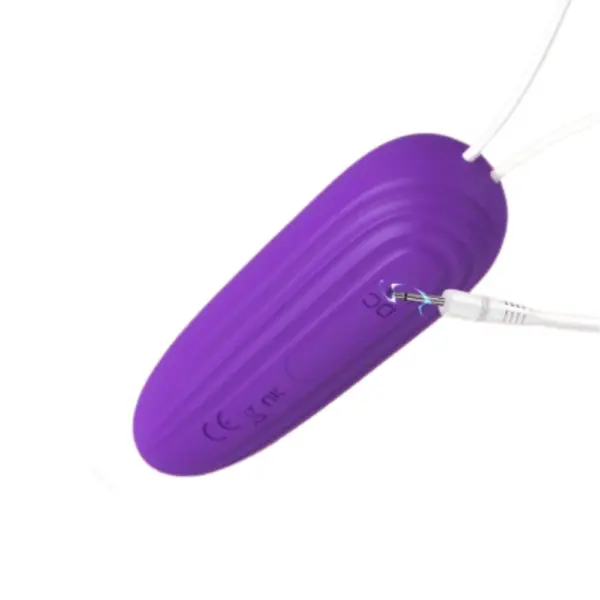 Hands-Free Egg Vibrator – Freya with USB charging cable plugged in, showing its discreet charging port and durable build.
