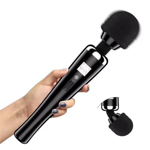 A person holding the black Extra Large Magic Wand – Magic Thunder, with motion blur on the head and a detachable silicone cap shown beside it.