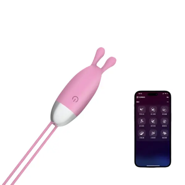 Smartphone Controlled Egg Vibrator – SmartLush placed next to a smartphone screen, illustrating its remote-control compatibility through a Bluetooth-enabled app.