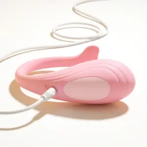 bottom view of the duodrop egg vibrator with it's charging cord connected.