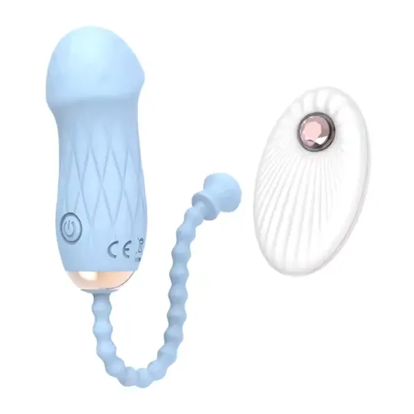 The sky blue Remote Control Love Egg-Luxe Pebble is shown alongside its coordinating white remote control. This smooth, pebble-shaped vibrator with a flexible beaded cord demonstrates both comfort and convenient wireless control.