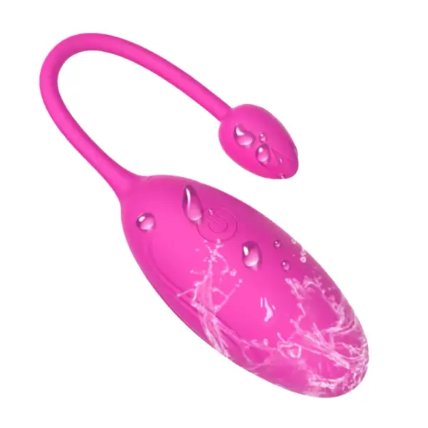 Vibrating Egg Sex Toy – Velvett with water splashes and droplets on its surface, emphasizing its waterproof design and sleek finish.