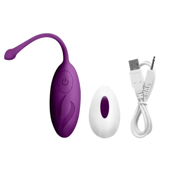 The Wireless Egg Vibrator – Whisper in purple shown with its matching white remote control and USB charging cable for convenient use and recharging.