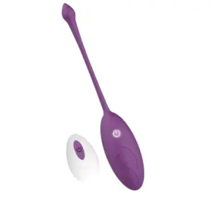 Angled view of the Wireless Egg Vibrator – Whisper showcasing its elongated retrieval tail and oval body alongside its compact wireless remote.