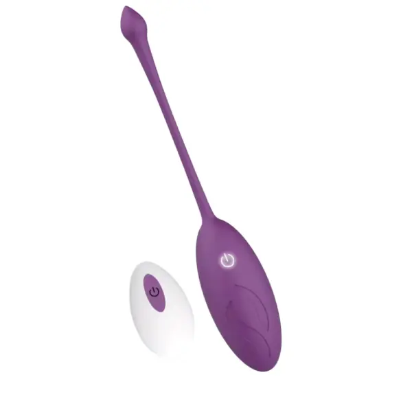 Angled view of the Wireless Egg Vibrator – Whisper showcasing its elongated retrieval tail and oval body alongside its compact wireless remote.